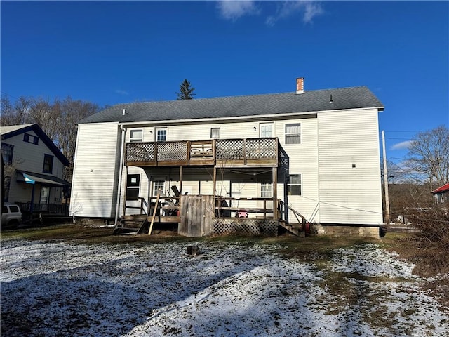 view of snow covered house