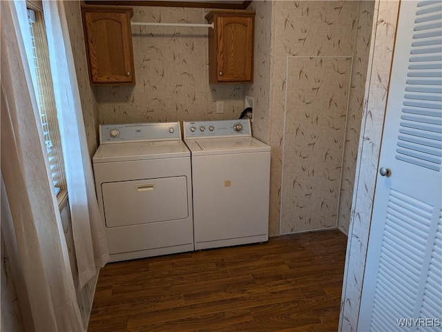 laundry area with cabinets, dark wood-type flooring, and independent washer and dryer