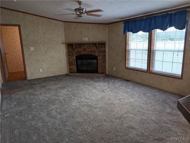 unfurnished living room with carpet flooring, ceiling fan, and ornamental molding