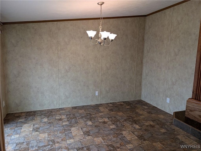 empty room with an inviting chandelier and crown molding