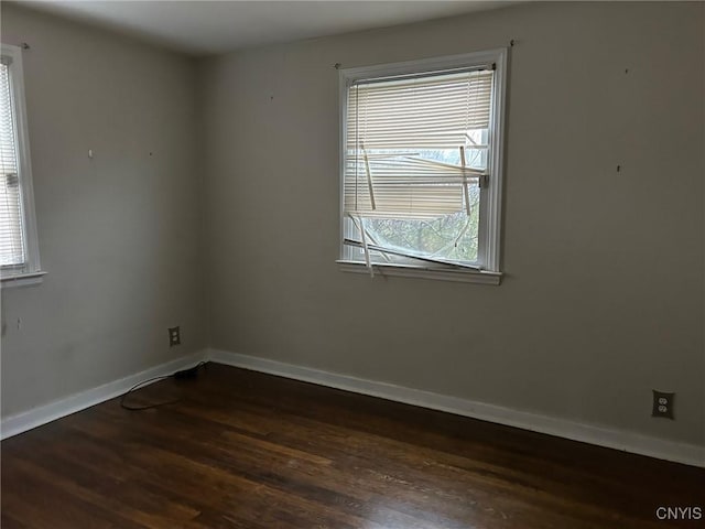 empty room featuring dark hardwood / wood-style floors