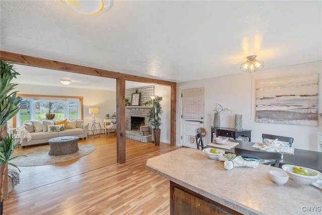 living room with a fireplace and hardwood / wood-style flooring