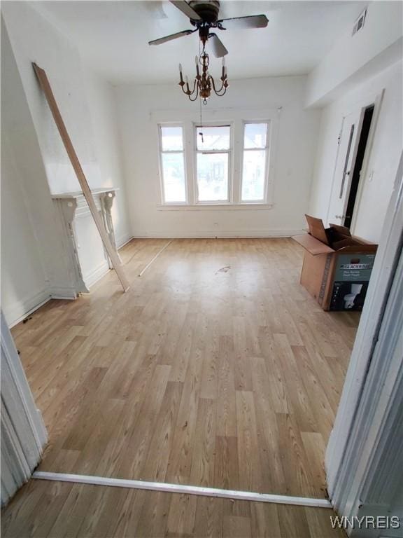 508 Howard St, Buffalo, NY 14206 - unfurnished living room with a ceiling fan and light wood-style flooring