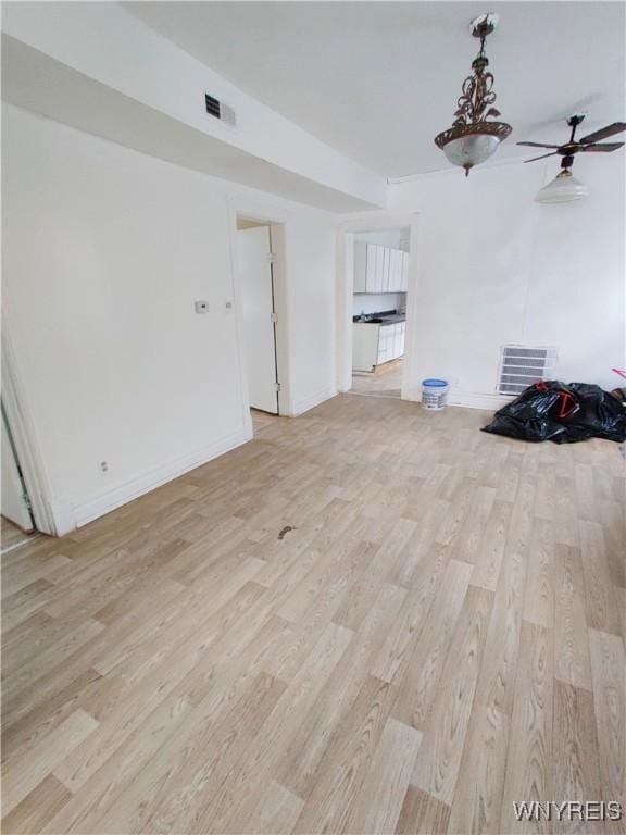 508 Howard St, Buffalo, NY 14206 - unfurnished living room featuring light wood-type flooring and ceiling fan