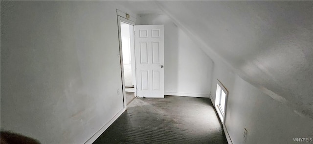 bonus room featuring vaulted ceiling