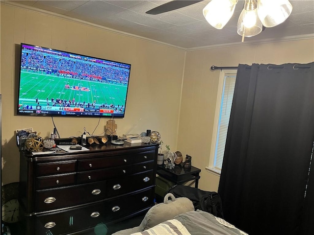 bedroom with ceiling fan and crown molding