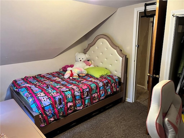 carpeted bedroom with lofted ceiling