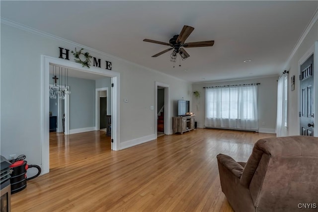 living room featuring ceiling fan, light hardwood / wood-style floors, and ornamental molding