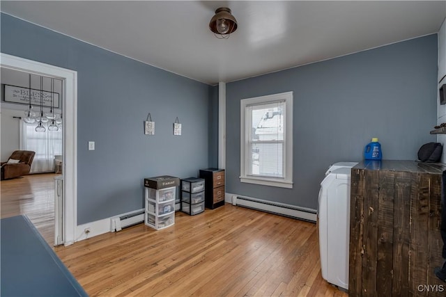 misc room with light wood-type flooring and a baseboard radiator