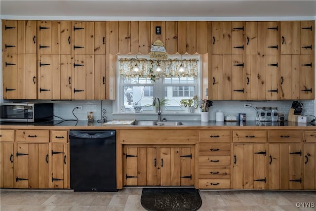 kitchen featuring sink, black dishwasher, hanging light fixtures, and tasteful backsplash