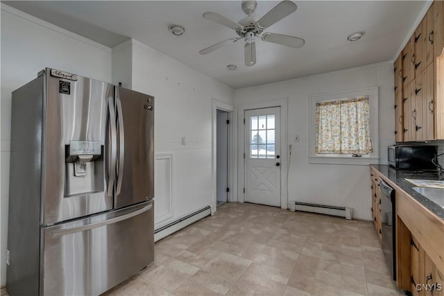 kitchen featuring appliances with stainless steel finishes, ornamental molding, ceiling fan, and a baseboard heating unit