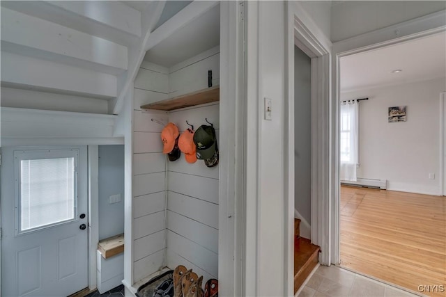 mudroom featuring a baseboard radiator and light hardwood / wood-style flooring