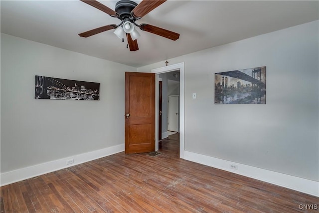 unfurnished room with wood-type flooring and ceiling fan