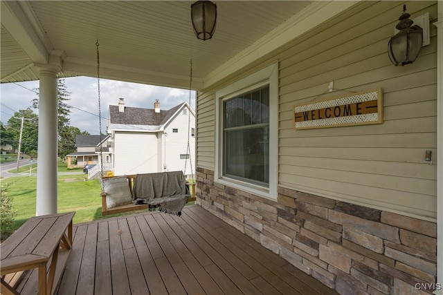 wooden deck featuring a porch