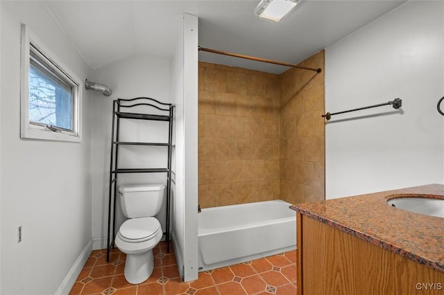 full bathroom with vanity, tiled shower / bath combo, vaulted ceiling, tile patterned flooring, and toilet