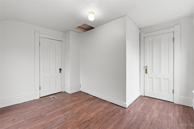 bonus room with hardwood / wood-style floors