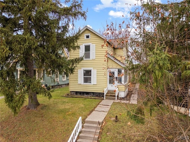 view of front facade with a front yard