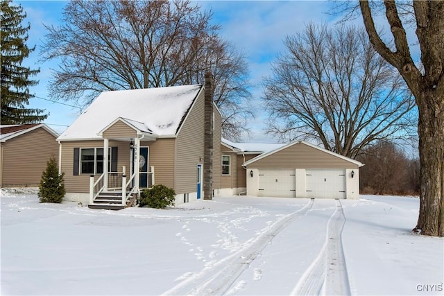 view of front facade with an outbuilding and a garage