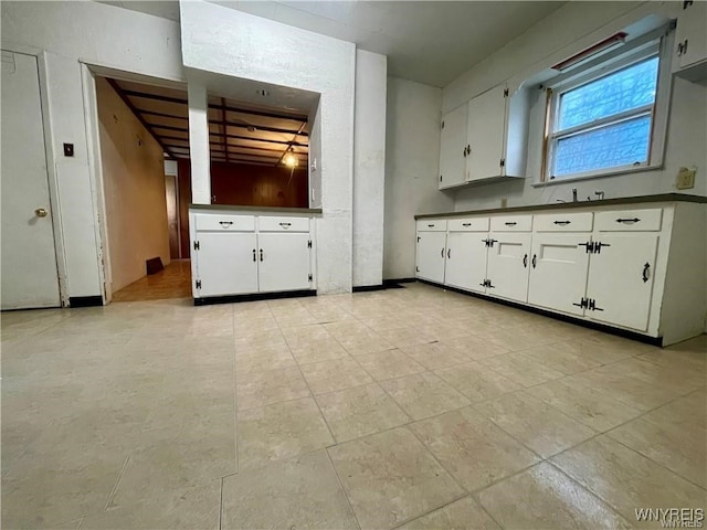 kitchen featuring white cabinets