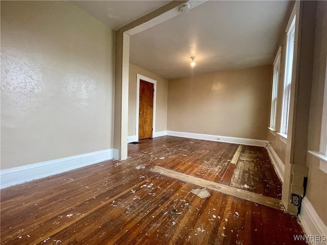 spare room featuring dark hardwood / wood-style floors