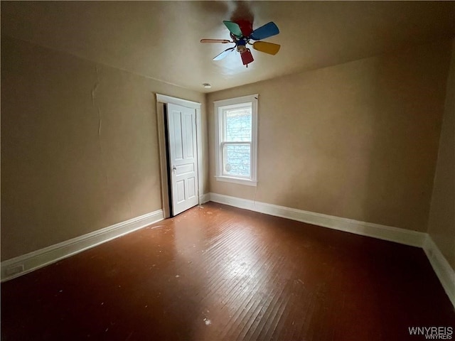 unfurnished room featuring ceiling fan and wood-type flooring