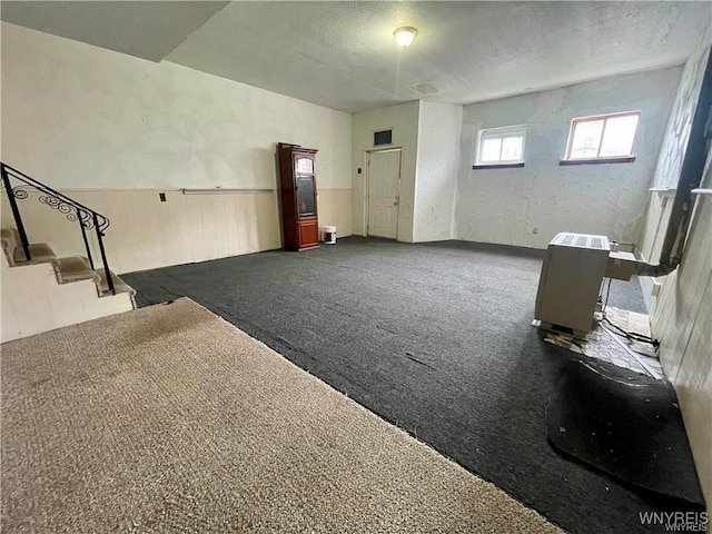 interior space featuring a textured ceiling