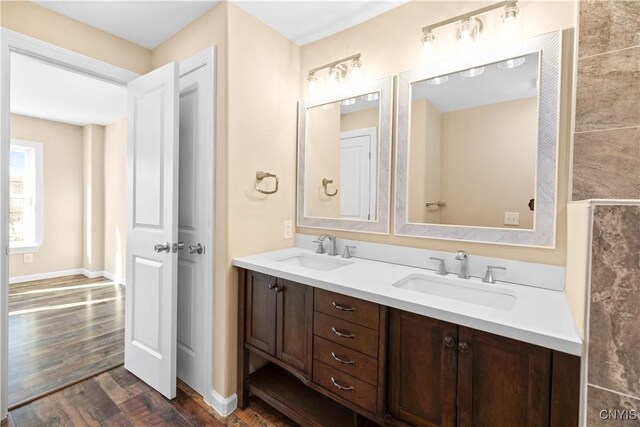 bathroom with hardwood / wood-style floors and vanity