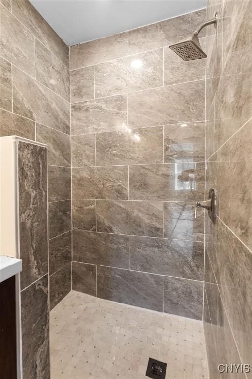 bathroom with a tile shower