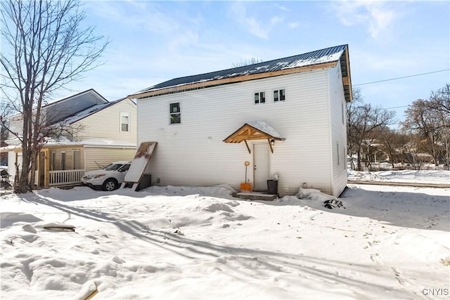 view of snow covered house