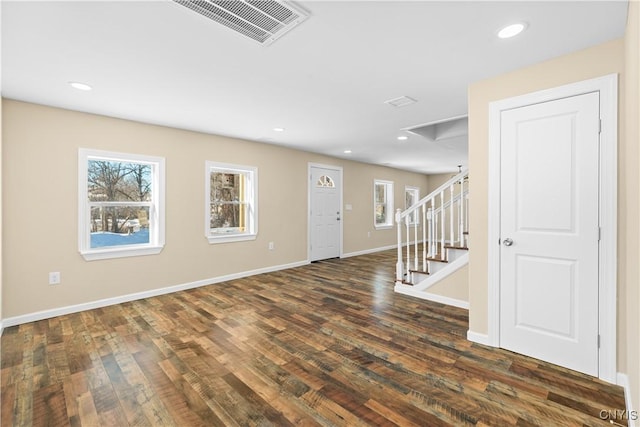 foyer featuring dark wood-type flooring