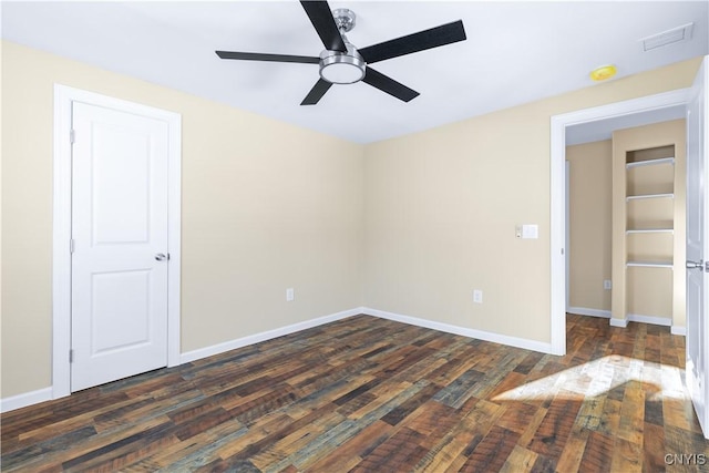 unfurnished room featuring dark hardwood / wood-style floors and ceiling fan