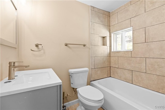 full bathroom with vanity, toilet, and tiled shower / bath