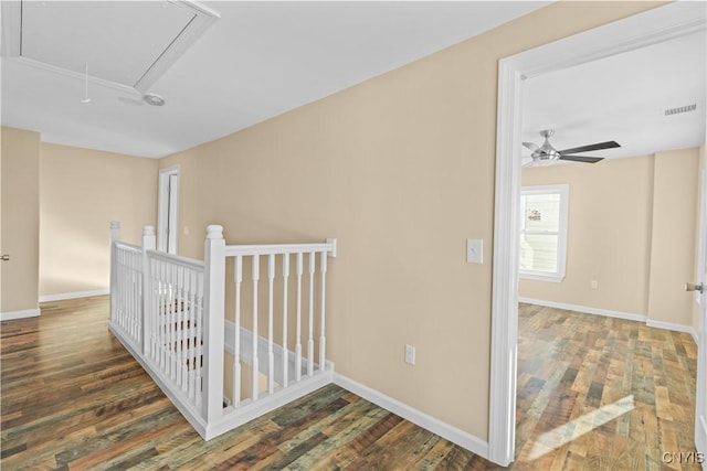 corridor featuring dark hardwood / wood-style flooring