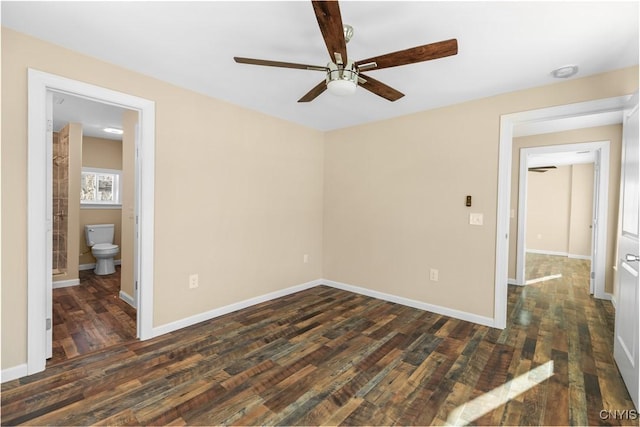 spare room featuring dark hardwood / wood-style flooring and ceiling fan