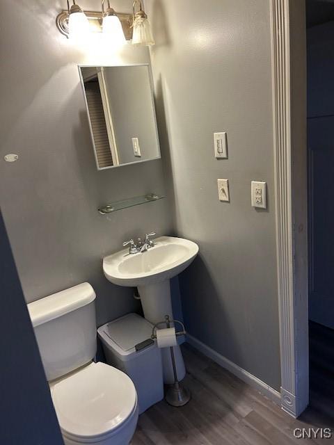 bathroom featuring toilet and hardwood / wood-style floors