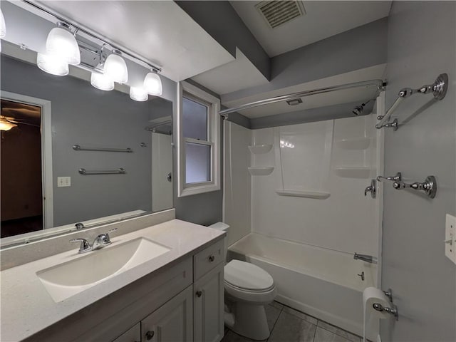 full bathroom featuring tile patterned flooring, vanity, toilet, and washtub / shower combination