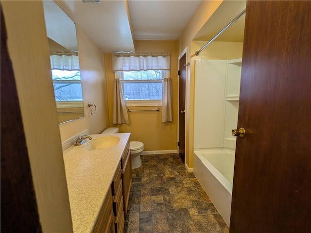 full bathroom with shower / bathing tub combination, vanity, and toilet