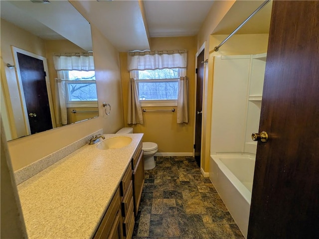 full bathroom with vanity, shower / bathtub combination, and toilet