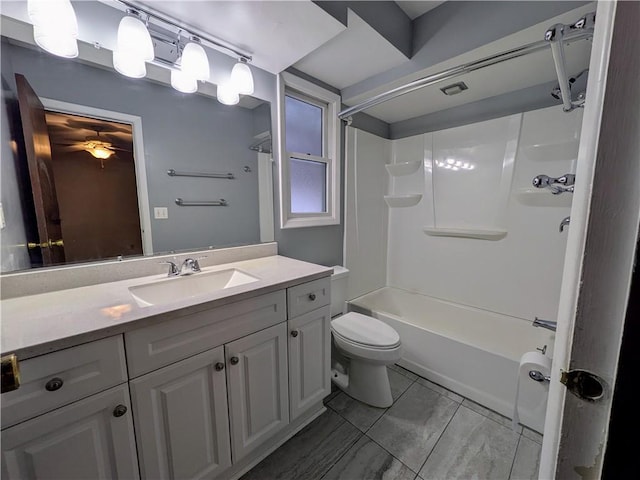 full bathroom featuring shower / washtub combination, vanity, and toilet