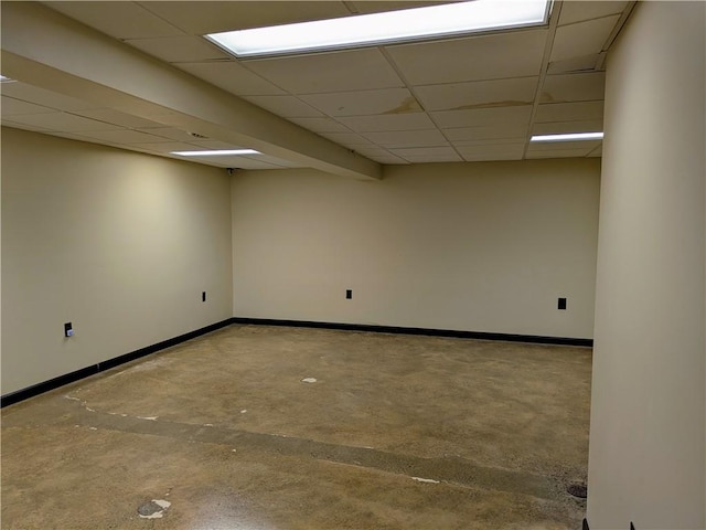 basement featuring a paneled ceiling