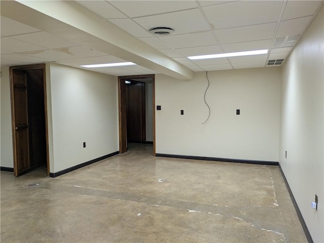 basement featuring a paneled ceiling