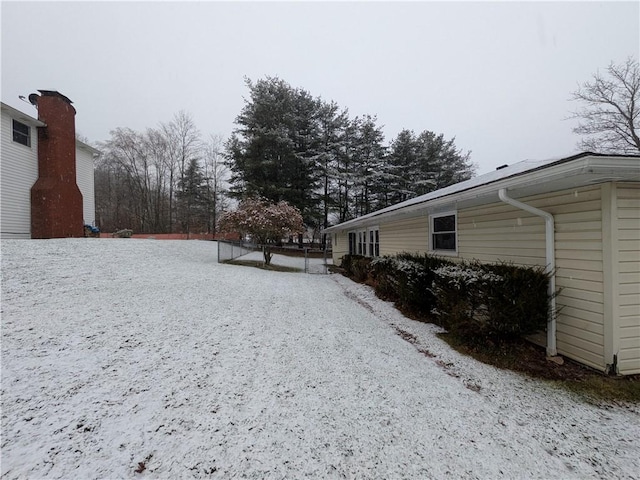 view of yard covered in snow