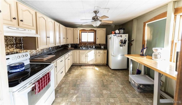 kitchen featuring ceiling fan, white appliances, sink, and backsplash