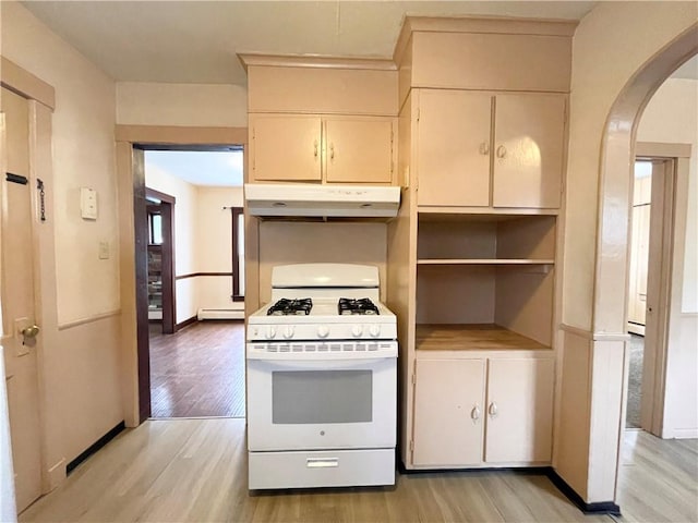 kitchen featuring white gas stove, light hardwood / wood-style floors, and a baseboard heating unit