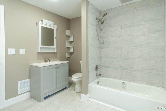 full bathroom featuring vanity, toilet, and tiled shower / bath