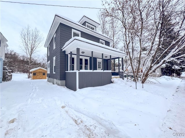 view of front of home with an outbuilding and a porch