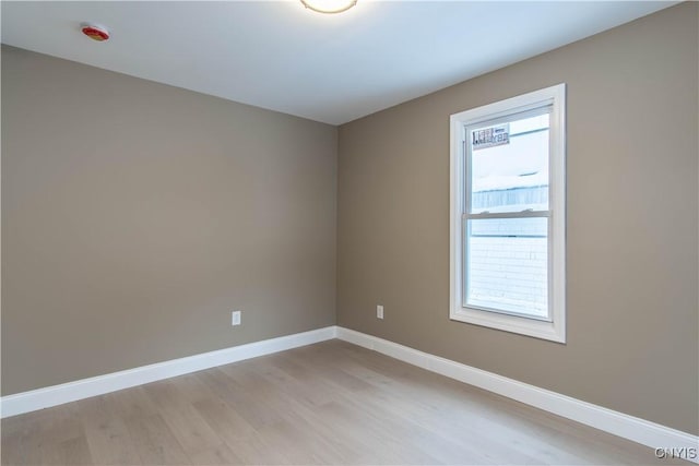 spare room featuring light hardwood / wood-style flooring