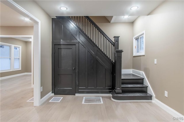 stairway featuring hardwood / wood-style floors