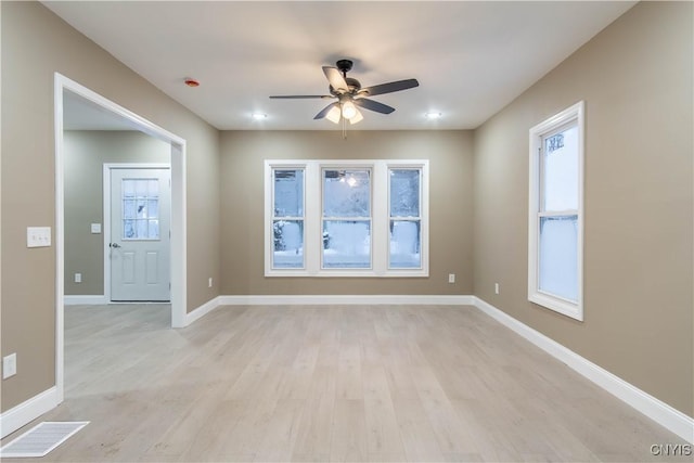 unfurnished room featuring ceiling fan and light hardwood / wood-style flooring