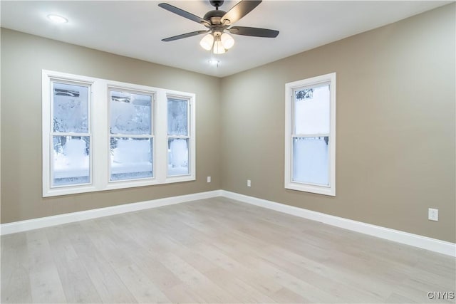 empty room with light wood-type flooring and ceiling fan